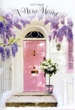 An Eastcote doorway is captured in that fleeting, magical moment when flowers and architecture combine to symbolise a fresh start. At the centre is a pale pink front door, its colour soft and comforting, reminiscent of early blossom along the paths that wind through Eastcote House Gardens in spring. The door is framed by whitewashed walls and a gently painted shutter that reflect the daylight with a quiet, powdery glow, enhancing the door's welcoming warmth. Above, trailing wisteria pours down in tumbling curtains of lavender blooms, each cluster dense and textured, wrapping the entrance in a fragrant, romantic canopy. The blossoms hang at varying lengths, casting delicate shadows and giving the impression of a secret, sheltered nook where time might slow for a moment. On the doorstep itself sits a generous floral arrangement in a vintage-style bucket, brimming with white and cream roses that appear freshly picked and carefully arranged. Their petals are plump and velvety, some cupped tightly, others unfolding to reveal intricate whorls at their centre. Soft green foliage curls around and between the roses, adding natural movement and a hint of woodland freshness. A soft pink ribbon is tied around the bucket, its bow slightly off-centre in that effortlessly elegant way that suggests a human touch. The whole scene exudes gentle optimism, as if it has been prepared to welcome someone moving into their first Eastcote flat or family home, arriving from nearby Ruislip Manor or Northwood Hills. It feels like a quiet celebration captured on a doorstep, where the scent of wisteria and roses blends with anticipation, turning this simple entryway into a visual message of good wishes, warmth, and the comforting promise of home.